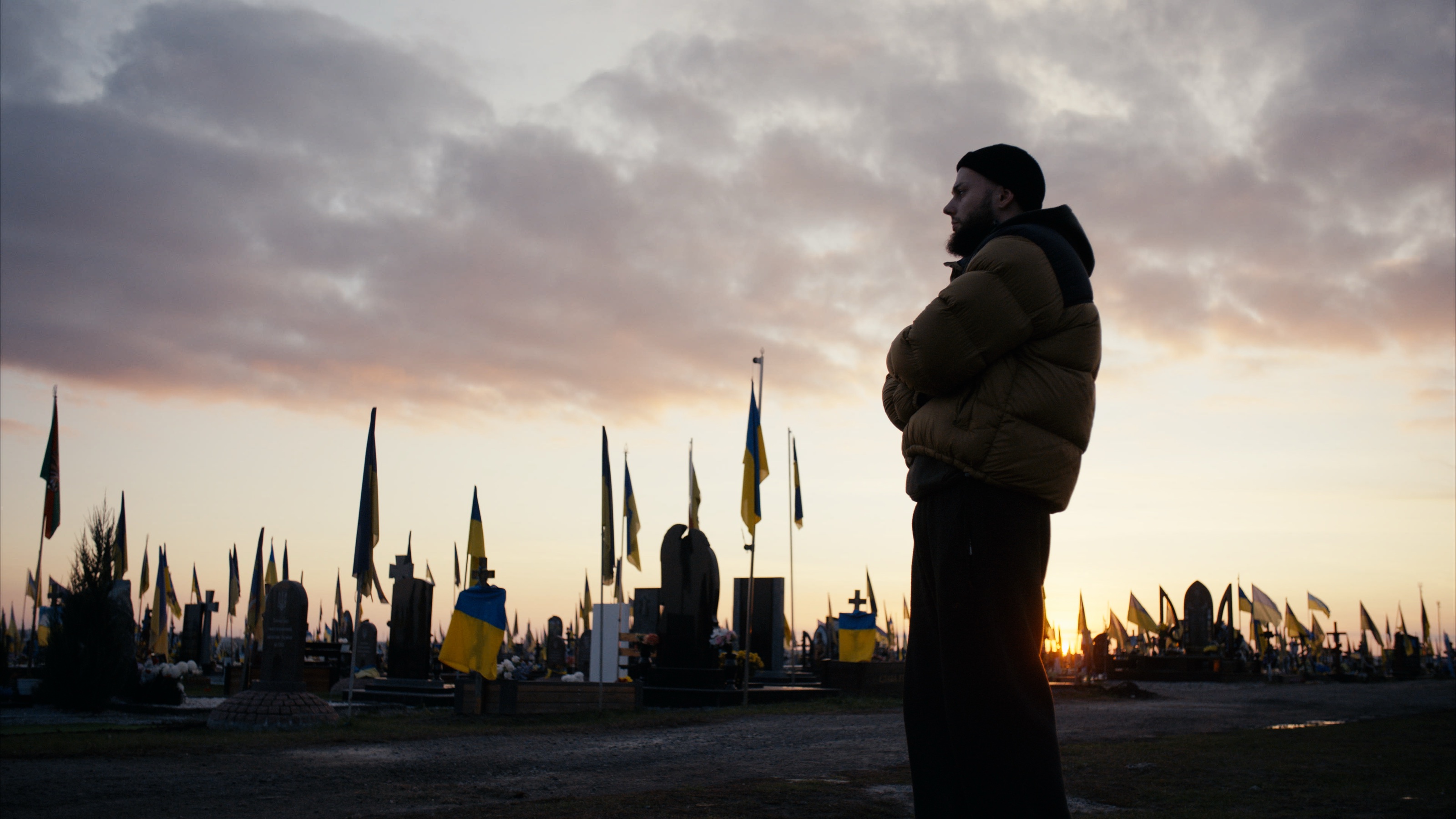 Bohdan among the flags at sunset.